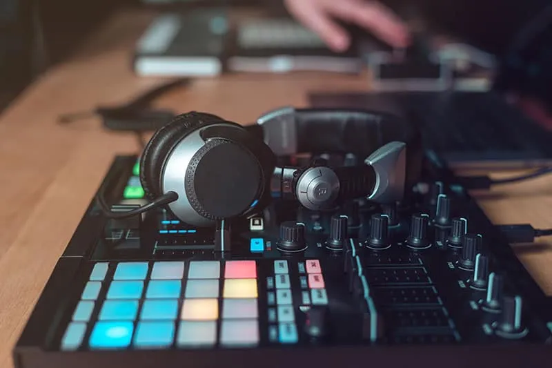 Headphones sitting on music equipment.