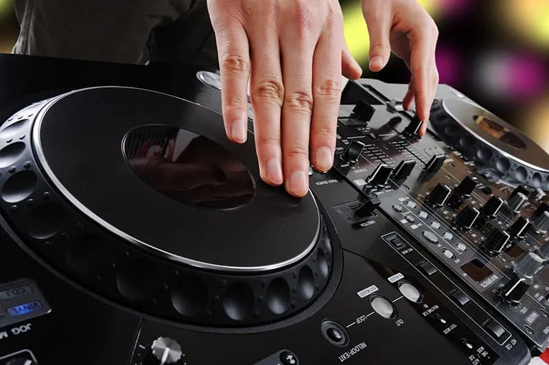 DJ mixing on DJ equipment.