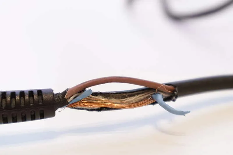 Close-up photo of a damaged power cable.