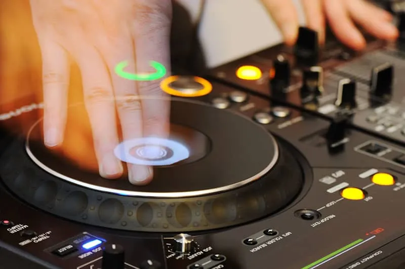 DJ playing on a DJ controller.